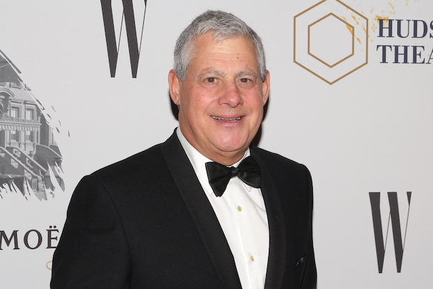 Cameron Mackintosh stands in from of a step and repeat at the Hudson Theatre.