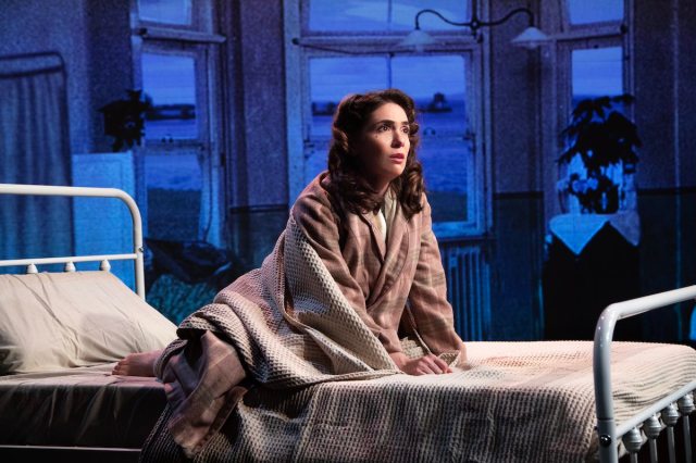 #3 MashaKing, Photo by David ZayasJr copy A woman leans forward on a bed.