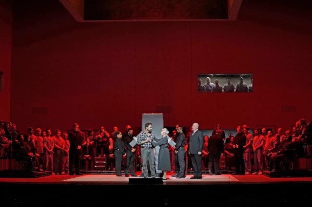 Joseph (Ryan McKinny) and Sister Helen (Joyce DiDonato) embrace in the execution chamber in <i>Dead Man Walking</i> at the Metropolitan Opera (© Karen Almond / Met Opera)