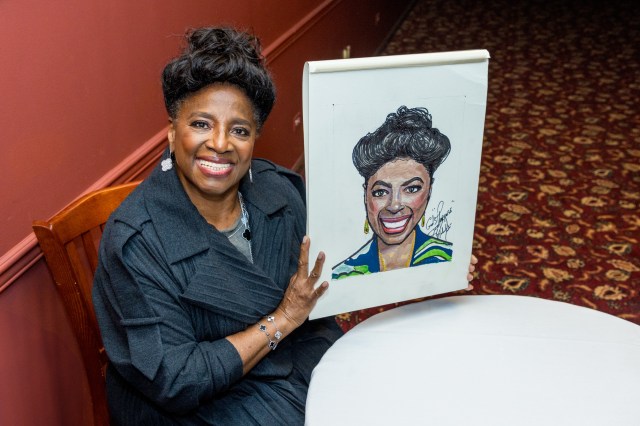 LaTanya Richardson Jackson holding Sardi's portrait