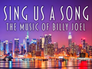 “Sing Us A Song”