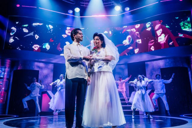 L—R: Chris Renfro, Reanne Acasio, and the company of <i>Here Lies Love</i> at the Mark Taper Forum (© Jeff Lorch)